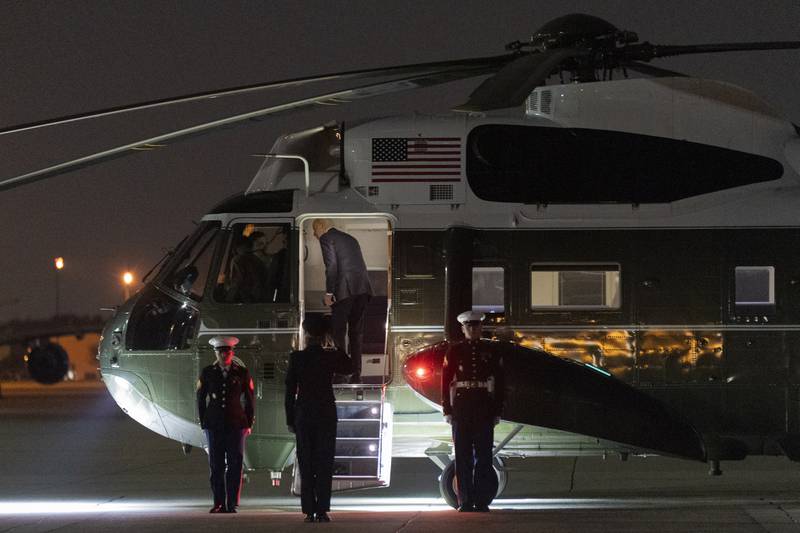 President Joe Biden boards Marine One upon arrival at Andrews Air Force Base, Md., from a campaign and fundraising trip to California, late Thursday, Feb. 22, 2024. (AP Photo/Manuel Balce Ceneta)