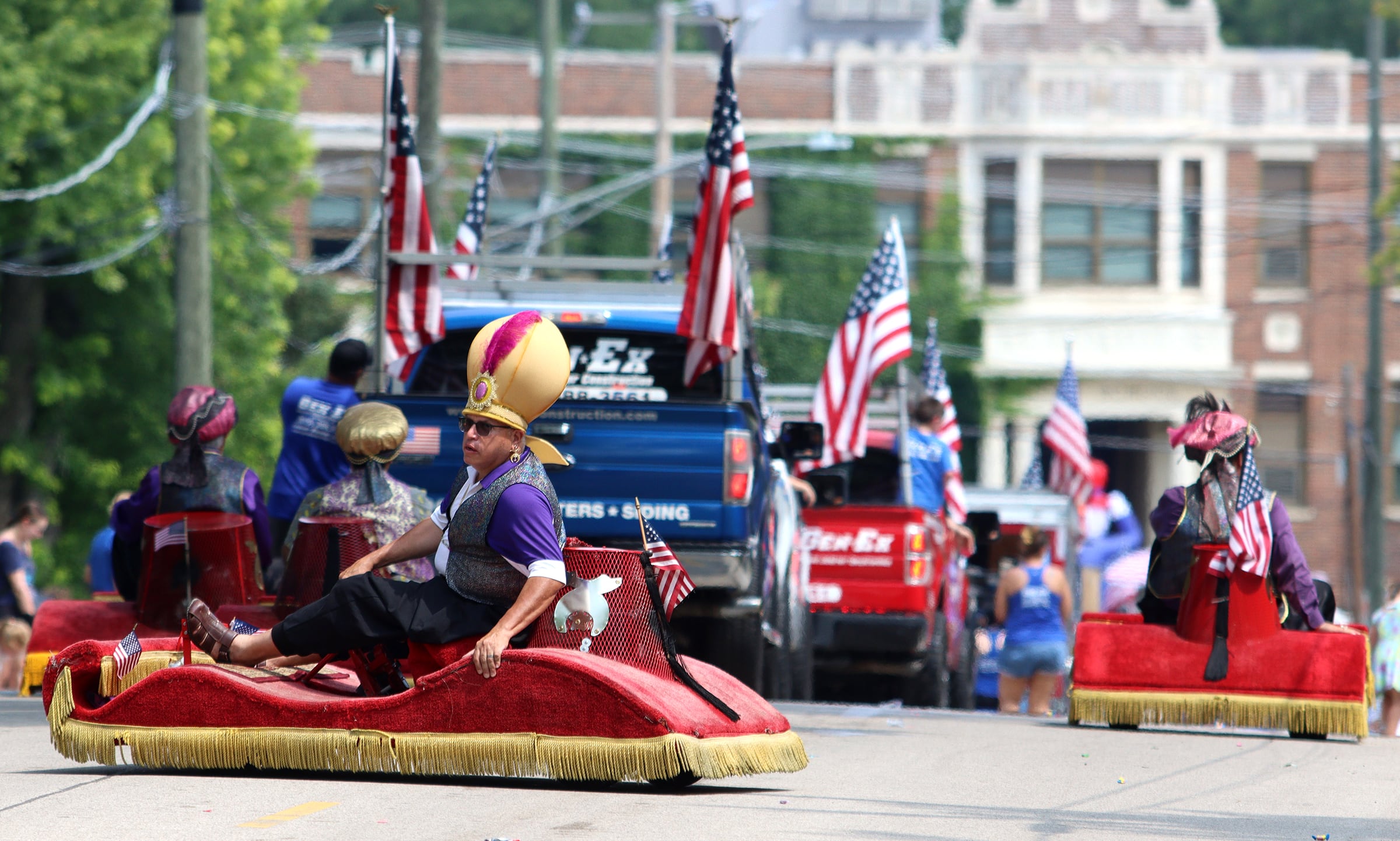 Entertainers cruise the Fiesta Days parade route along Main Street in McHenry Sunday.