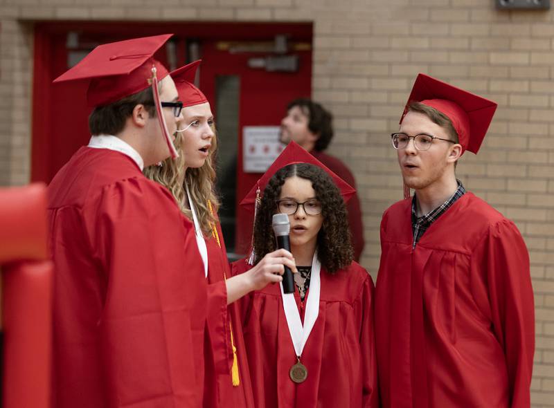 Graduates sing "The Star Spangled Banner" on Friday, May 24, 2024, in Kingman Gym.