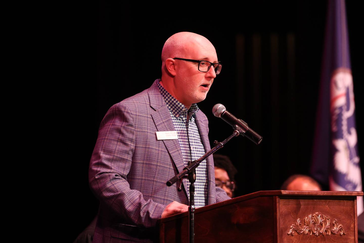 Rialto Executive Director Wade Welsh makes opening remarks during the Special Naturalization Ceremony held at the Rialto Square Theatre in downtown Joliet on Tuesday, April 23, 2024.