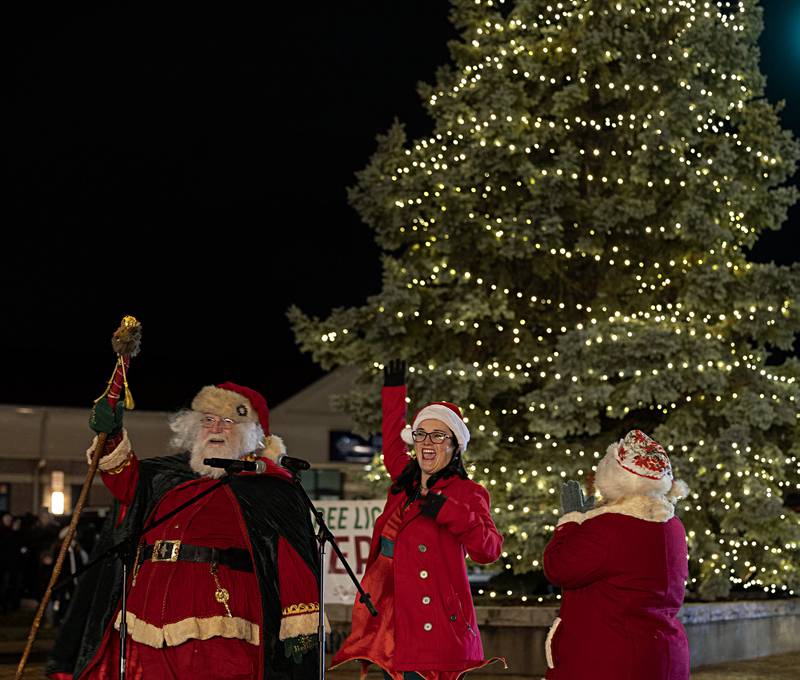 Santa, Sterling mayor Diana Merdian and Mrs. Claus cheer the lighting of the Christmas tree Friday, Dec. 1, 2023 in Sterling.