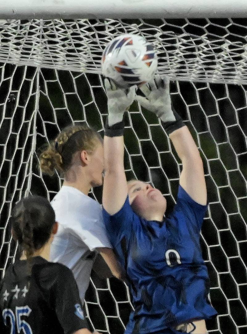 St. Charles North High School’s Lauren Korioth deflects a Winnetka New Trier High School shot in the IHSA Class 3A championship game at North Central College in Naperville on Saturday, June 1, 2024.