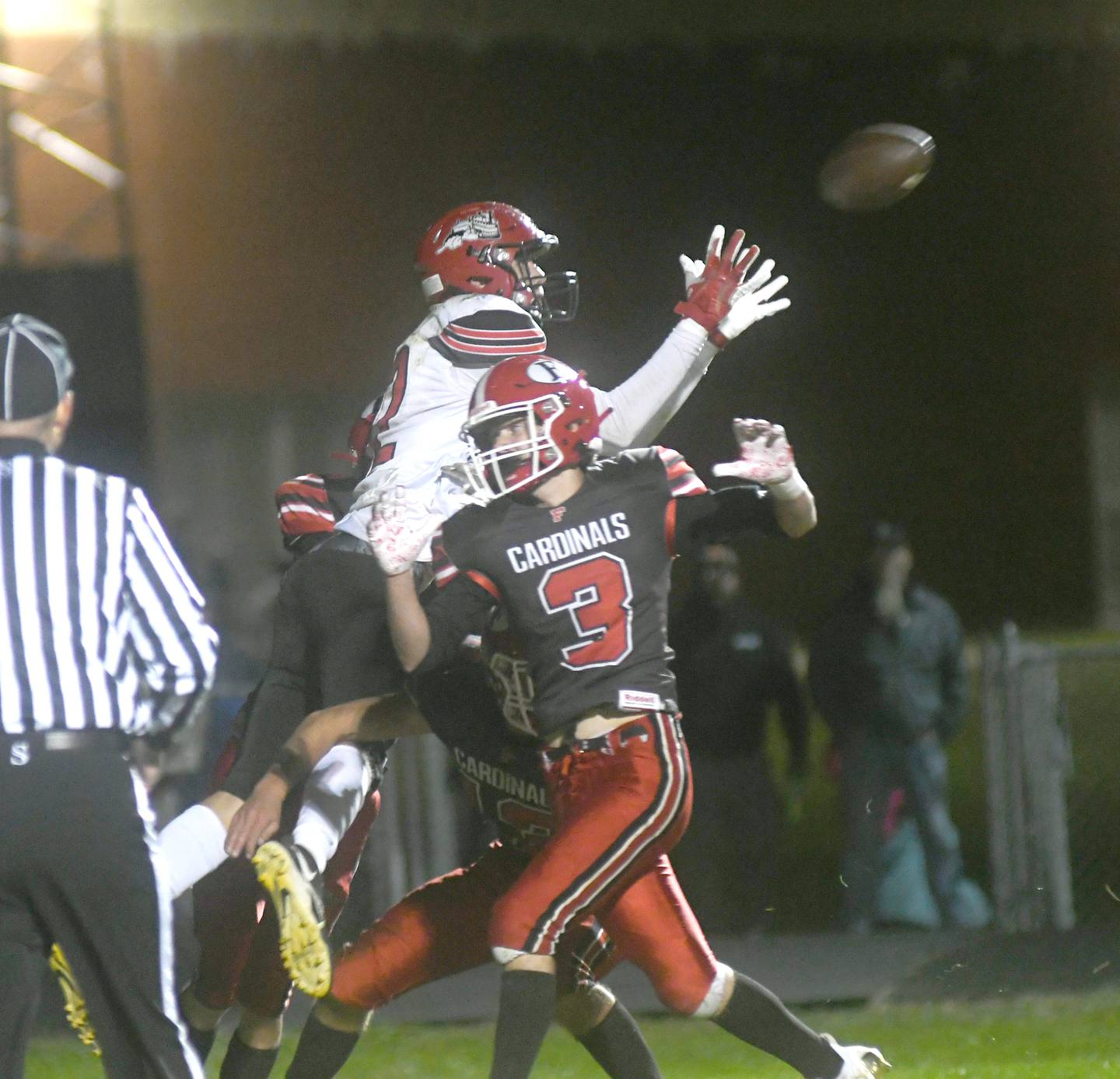 Fulton's Baylen Damhoff jumps over three Forreston defenders for a game winning touchdown in the fourth quarter during  Oct. 7 action in Forreston. The Steamers won the game 30-28.