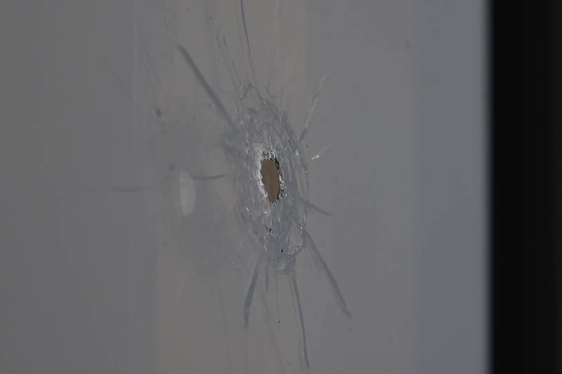 A bullet hole is visible in the window of Merichka’s on Wednesday, April 3, 2024 in Joliet.