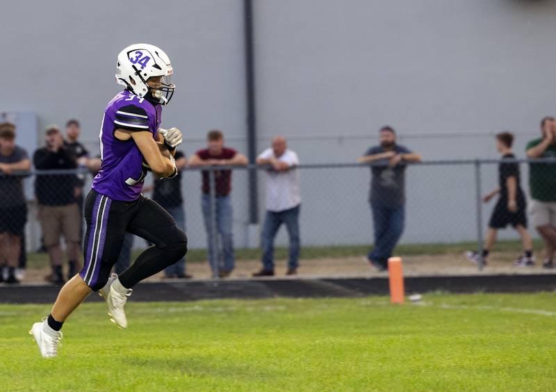 Dixon’s Owen Belzer punches it in for a TD against Stillman Valley Friday, Aug. 30, 2024 at Dixon High School.