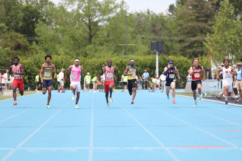 Runners sprint to the finish line in the Class 3A 100 Meter State Finals on Saturday, May 27, 2023 in Charleston.