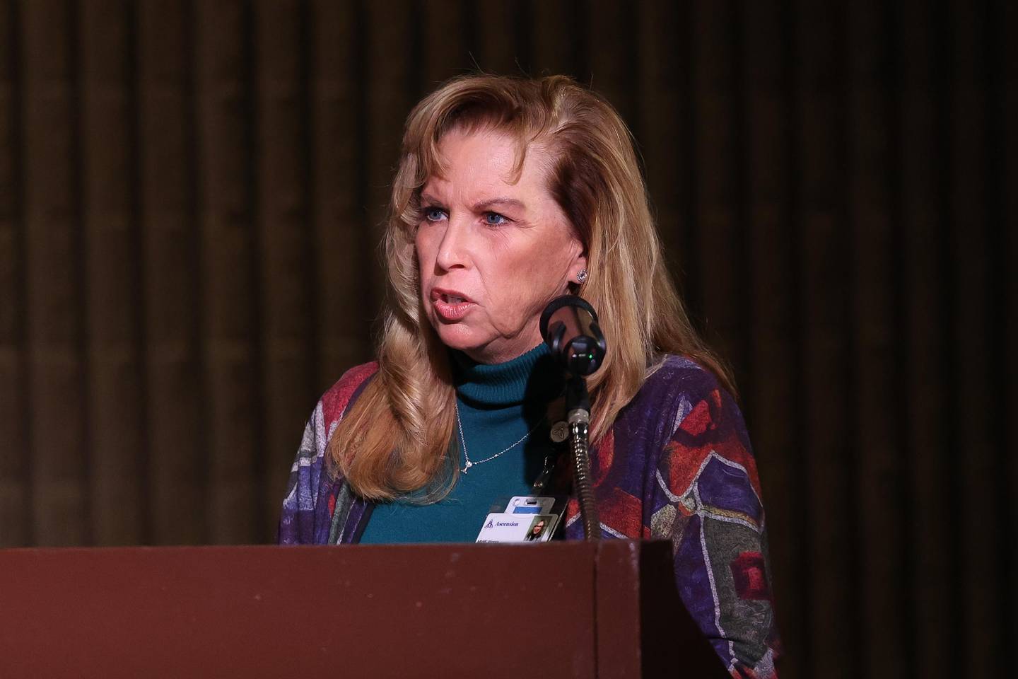 Polly Davenport, Ascension Illinois Ministry Marketing Executive, speaks at a public hearing on the planned sale of Ascension Saint Joseph – Joliet hospital hosted by the Health Facilities & Services Review Board on Friday, Sept. 6, 2024 in Joliet