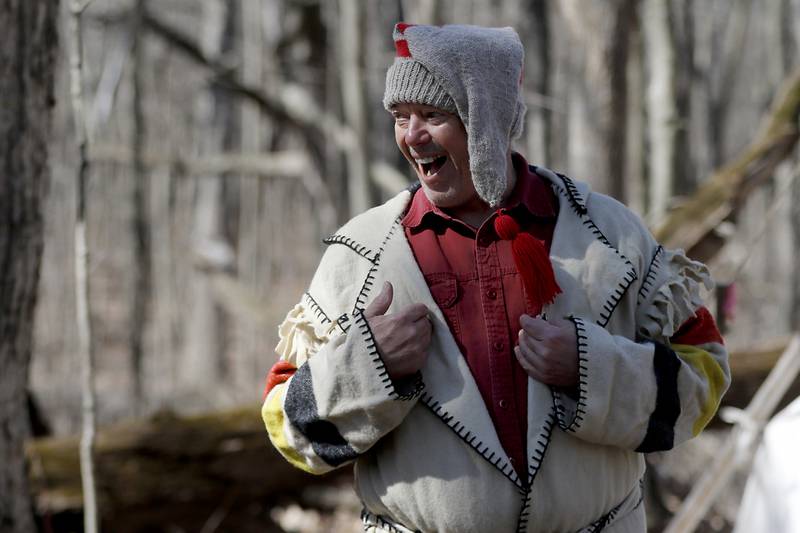 Volunteer Rich Tobiasz, dressed in early 1700’s era clothing, talks how native Americans discover maple surfing while teaching about the history of maple sugaring during the McHenry County Conservation District’s annual Festival of the Sugar Maples, at Coral Woods Conservation Area, 7400 Somerset Drive in Marengo. People were able to walk through the woods and learn about history of maple sugaring and the evolution of the sap collection process during the one hour long half-mile hike through a woodland trail, on Monday, March 11, 2024. The festival continues on March, 16, and 17.