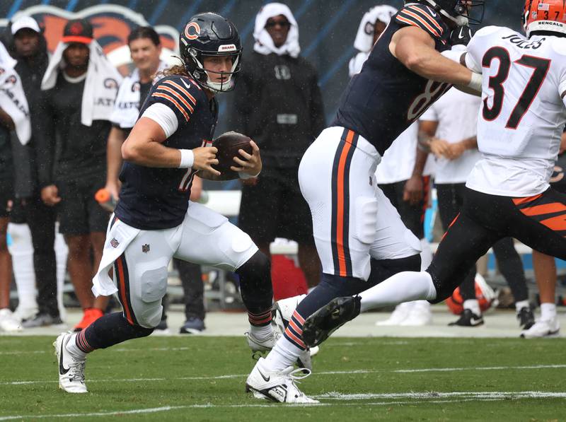 Chicago Bears quarterback Tyson Bagent carries the ball for a gain during their game against the Cincinnati Bengals Saturday, Aug. 17, 2024, at Soldier Field in Chicago.