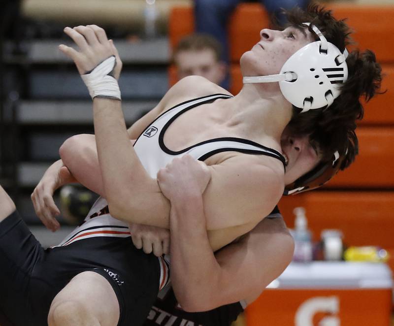 Prairie Ridge’s Milkey Meade tries to control  Kaneland’s Alex Gochis during the 126-pound championship match of a the IHSA 2A Crystal Lake Central Wrestling Regional on Saturday, Feb. 3, 2024, at Crystal Lake Central High School.