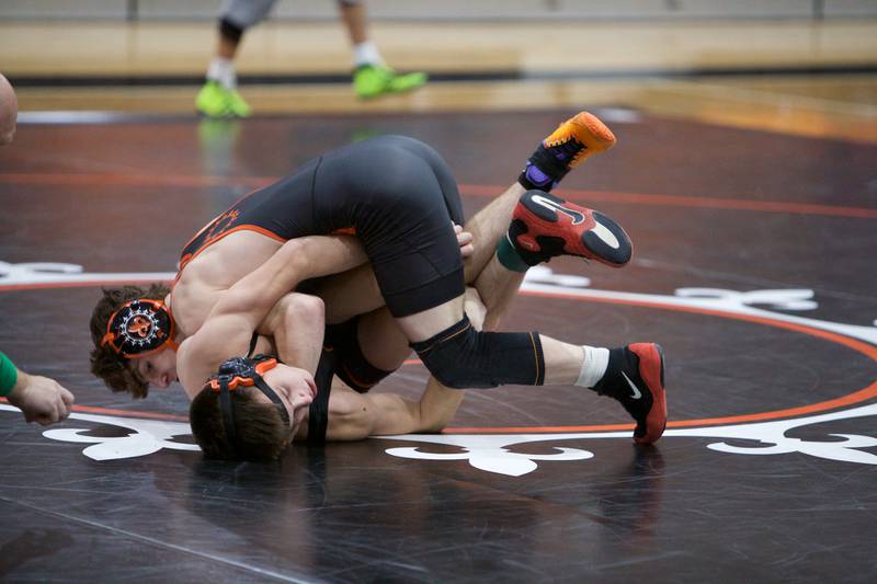 St. Charles East's Jayden Colon and Libertyville's Will Carney compete in the 144 lb. class at the St. Charles East wrestling meet on Saturday, Dec.2, 2023 in St. Charles.