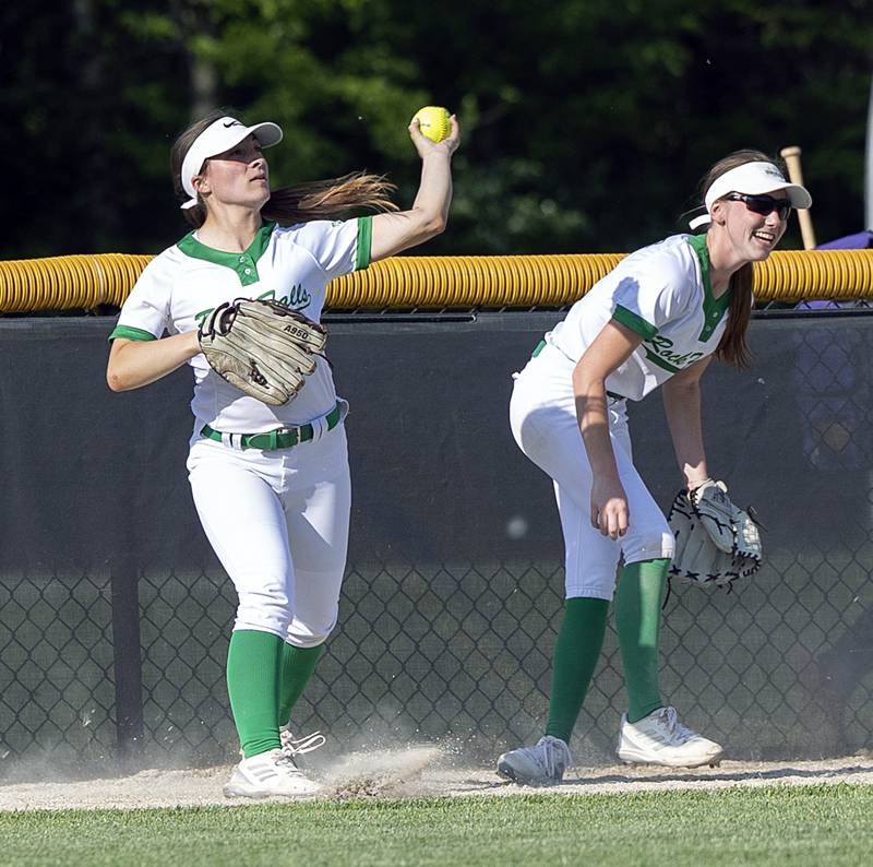 Rock Falls’ Emma Skinner (left) throws the ball in from left field against Princeton Wednesday, May 15, 2024 a the Class 2A regional softball semifinal.