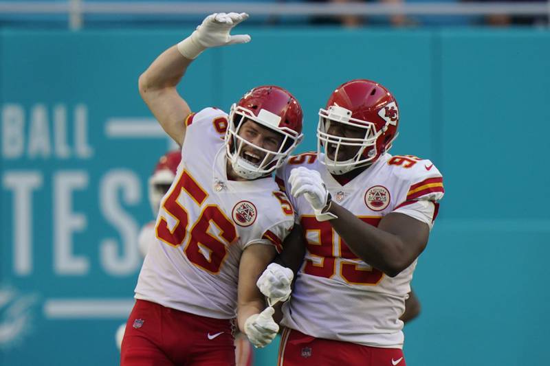 Kansas City Chiefs outside linebacker Ben Niemann (56) and defensive tackle Chris Jones (95) celebrate after Jones sacked Miami Dolphins quarterback Tua Tagovailoa in the enzone for a safety, during the second half of an NFL football game, Sunday, Dec. 13, 2020, in Miami Gardens, Fla. (AP Photo/Lynne Sladky)