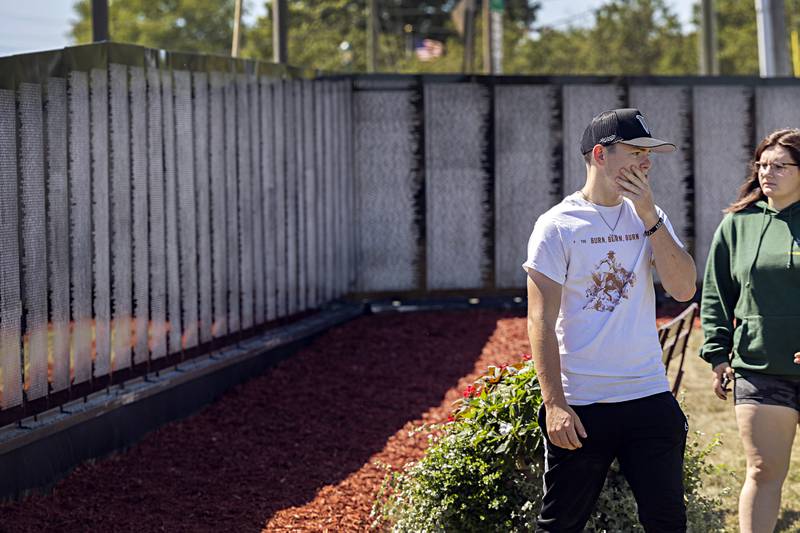 Connor Mullan and Zoe Morgan of Rock Falls visit the Vietnam Traveling Memorial Wall Thursday, August 31, 2023. The two were a bit overwhelmed at the impact the wall made on them.