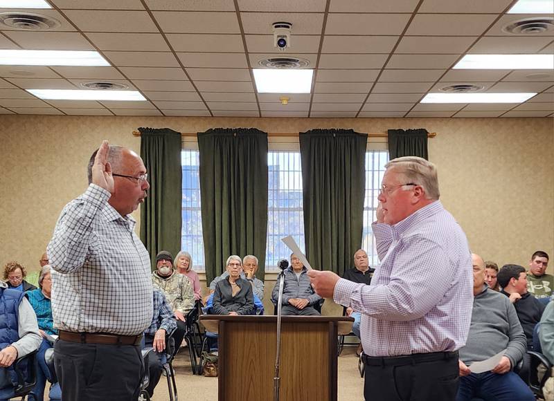 Princeton Mayor Ray Mabry delivers the oath of office to City Clerk Peter Nelson during the Monday, May 1, 2023 city council meeting.