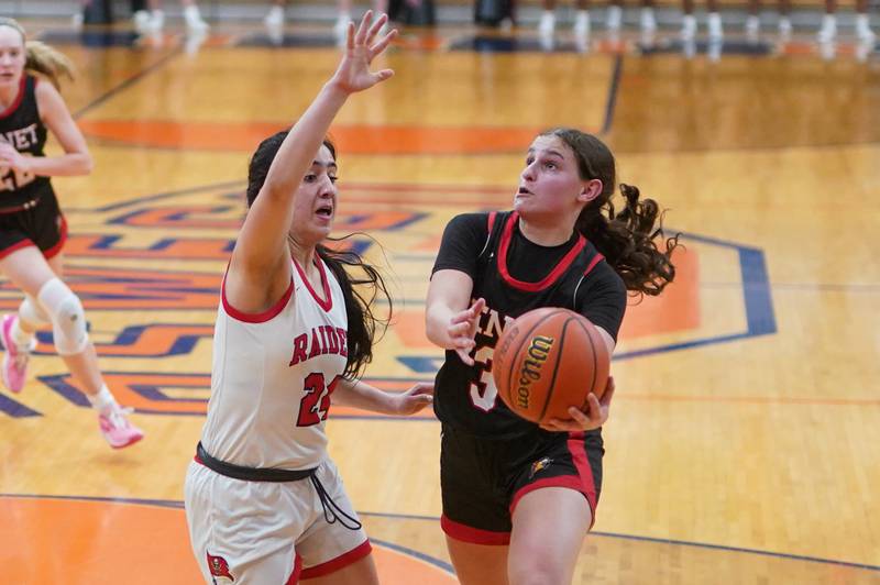 Benet’s Aria Mazza (3) drives to the basket against Bolingbrook's Persais Williams (21) during a Oswego semifinal sectional 4A basketball game at Oswego High School on Tuesday, Feb 20, 2024.