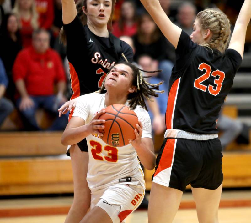 Batavia’s Addison Prewitt gets between St. Charles East defenders Sofia O’Sullivan and Alyse Price during a Class 4A Batavia Sectional semifinal game on Tuesday, Feb. 20, 2024.