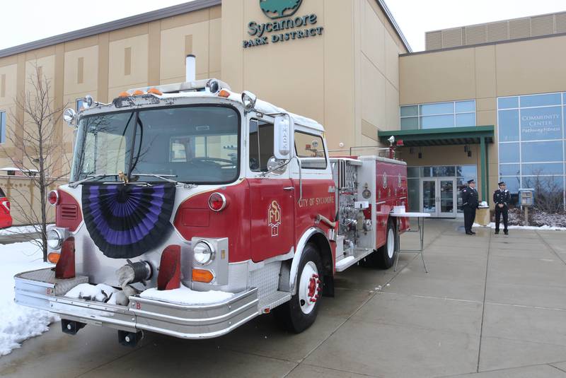 A vintage Sycamore fire truck sits in front of the Sycamore Park District Community Center Saturday, Jan. 6, 2024, at the visitation for Sycamore firefighter/paramedic Bradley Belanger. Belanger, 45, who worked with the Sycamore Fire Department for more than two decades, died Friday, Dec. 22, after a yearlong battle with cancer.