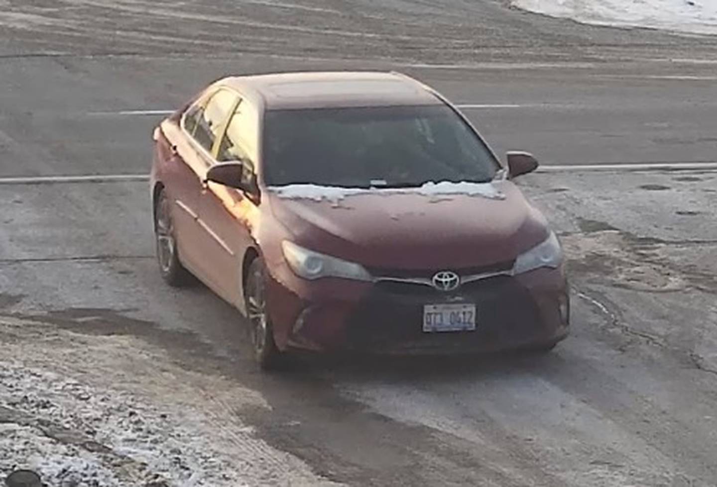 A photo of a red Toyota Camry with a license plate of Q73 0412 released by the Will County Sheriff’s Office. Authorities said the vehicle is connected to a fatal shooting in Joliet Township.