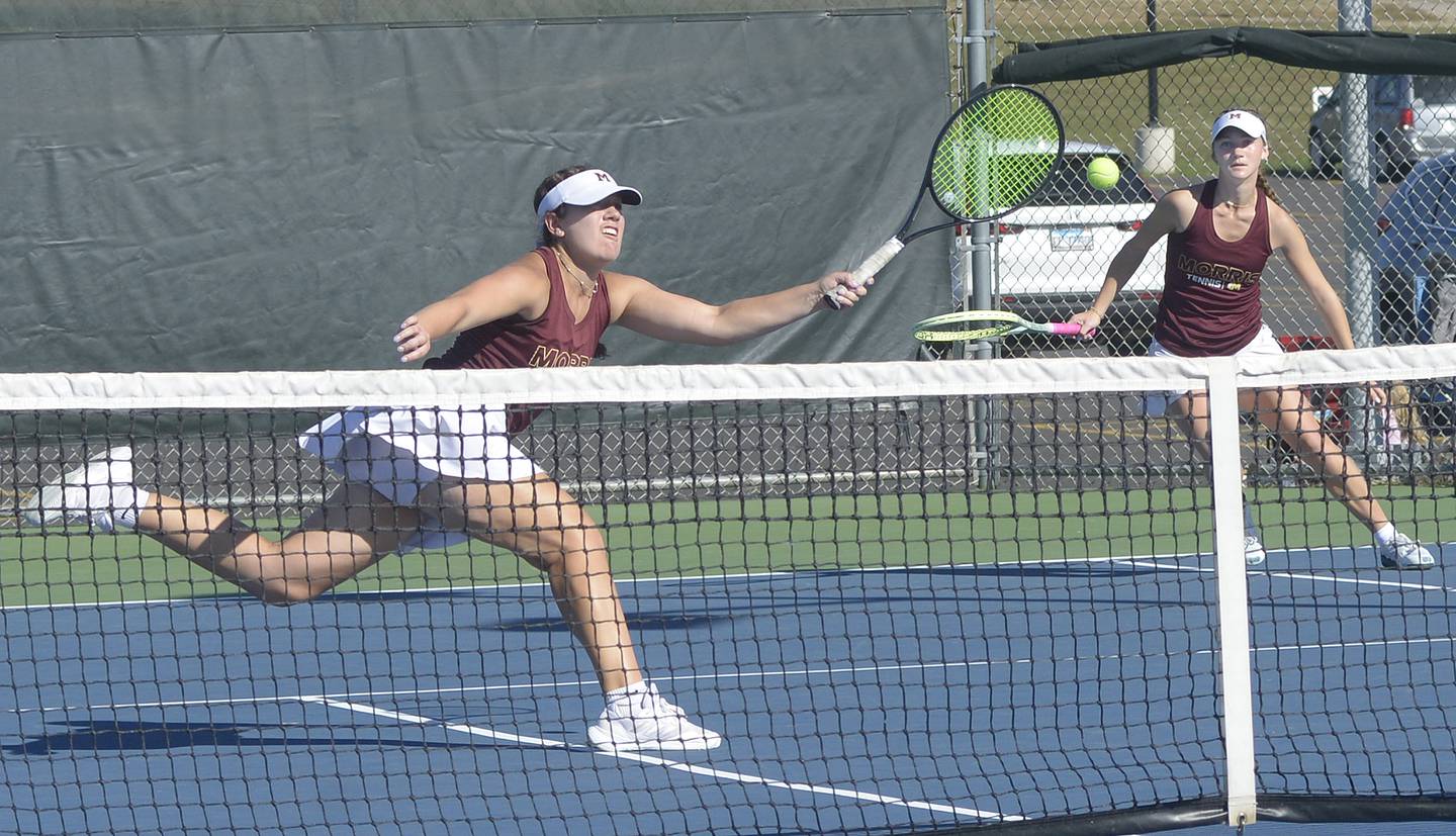 The Morris doubles team of senior Julia Borgstrom and junior Skyler Saelens work for a point during their doubles finals match against Pontiac of Saturday's Class 1A Ottawa Sectional at the Henderson-Guenther Tennis Facility.