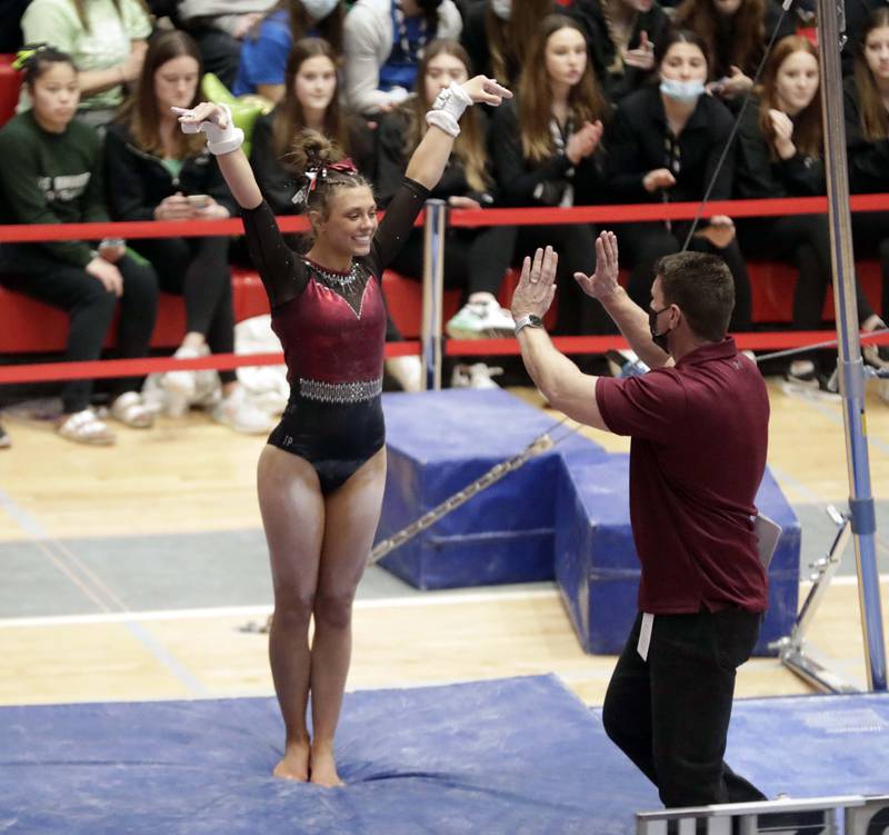 Prairie Ridge's Gabriella Riley competes on the uneven parallel bars during the IHSA Girls Gymnastics State Final meet Friday February 18, 2022 at Palatine High School.