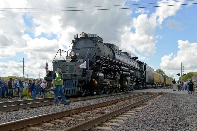 A Union Pacific employee that works on the Big Boy Steam Engine No. 4014 stands in front of the train during its whistle stop on Friday, Sept. 6, 2024, at the Sterling Marketplace.