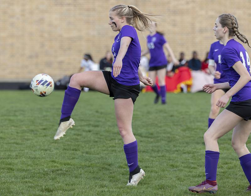 Dixon’s Micki Worrell plays the ball upfield against Rock Island Friday, April 12, 2024 in Dixon.