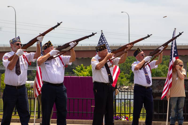 Veterans perform a rifle salute Saturday, June 15, 2024, during the Illinois Motorcycle Freedom Run's ceremony at the Middle East Conflicts Wall in Marseilles.