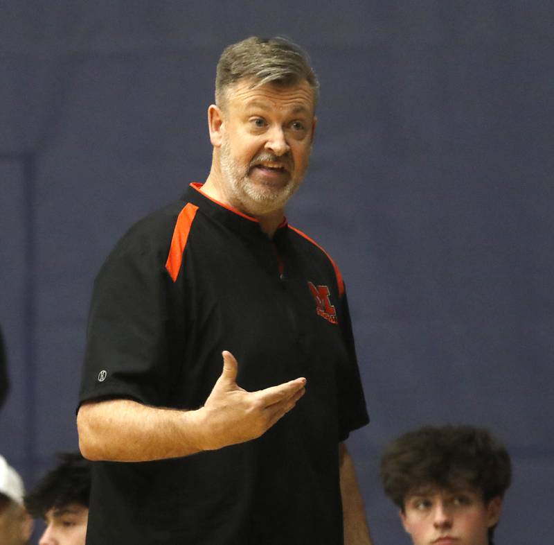 McHenry Head Coach Corky Card questions a call during the IHSA Class 4A Guilford Boys Basketball Sectional semifinal game against Hononegah on Wednesday, Feb. 28, 2024, at Rock Valley College in Rockford.