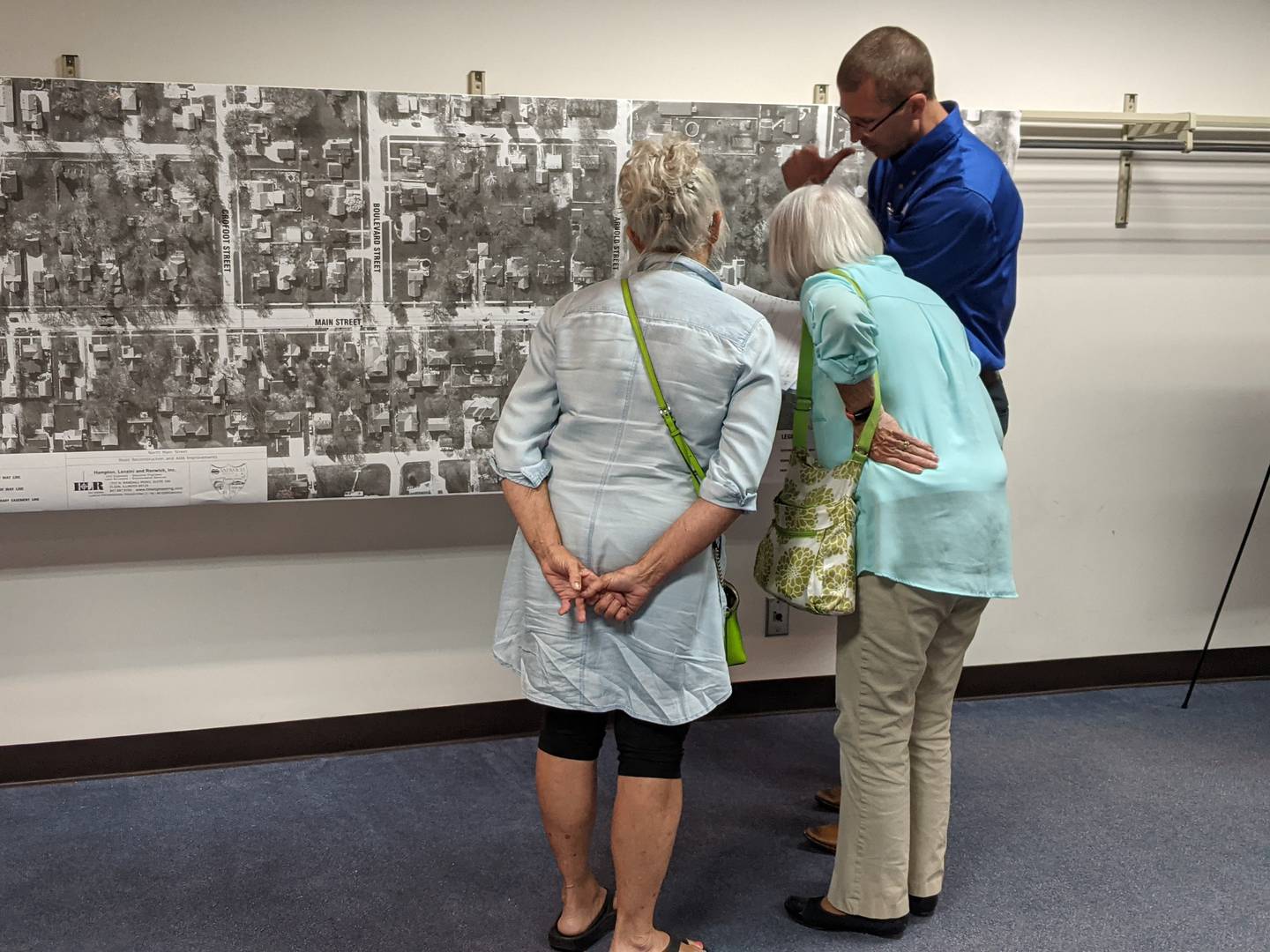Troy Strange, right, of civil engineering company Hampton, Lenzini and Renwick, Inc., talks about the planned reconstruction of North Main Street in Sandwich during a June 26 open house.