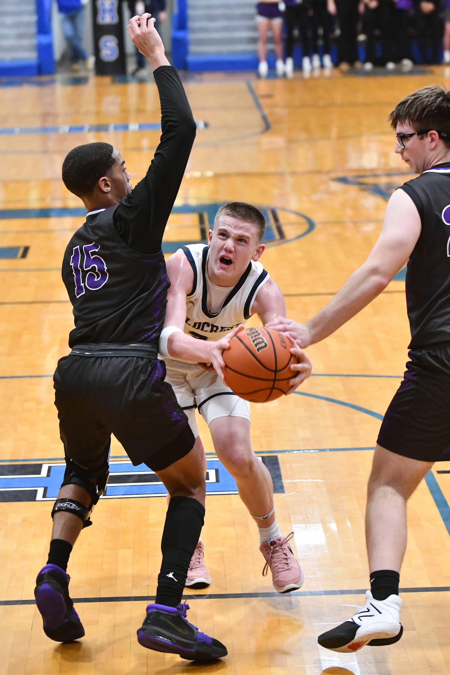 Fieldcrest's Ed Lorton draws a foul as he manuevers to the basket under pressure from two Manteno defenders Tuesday during the Knights' 53-37 victory over Manteno in the IHSA Class 2A Clifton Central Sectional semifinal game.