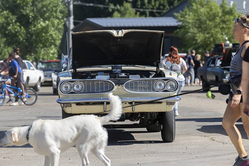 Visitors to Rock Falls’ block party check out the high performance rides Monday, June 10, 2024. The racers were traveling from speedway to speedway - Byron to Cordova.