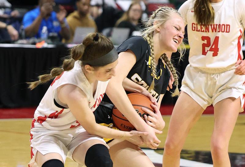 Hinsdale South's Sloane Kiefer and Glenwood's Karley Hawkins fight for possession during their game Friday, March 1, 2024, in the IHSA Class 3A state semifinal at the CEFCU Arena at Illinois State University in Normal.