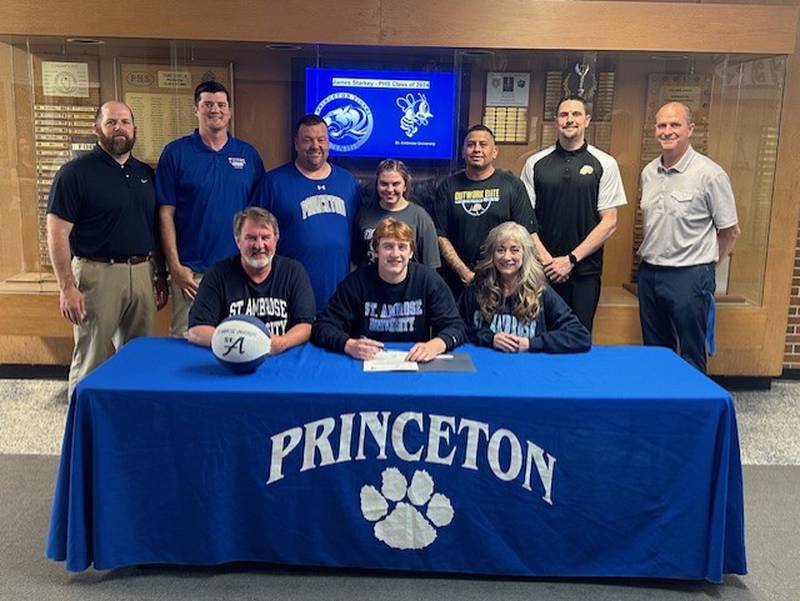 Princeton's Jimmy Starkey signs to play basketball for St. Ambrose University next season. He was joined at his signing by his parents,  James (front row) and Rachel Starkey; and (back row) PHS assistant coaches Michael Fredericks and Nathan Koning, PHS head coach Jason Smith, PHS maanger Emily Smith, Outwork Elite coaches DJ Olalde and Josh Binder and PHS assistant coach Tim Smith.