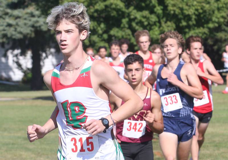 L-P's Griffin Hammers, Morris's Diego Lugo, and Fieldcrest's Caleb Krischel compete during the Gary Coates Cross Country Invitational on Saturday, Sept. 14, 2024 Zearing Park in Princeton.