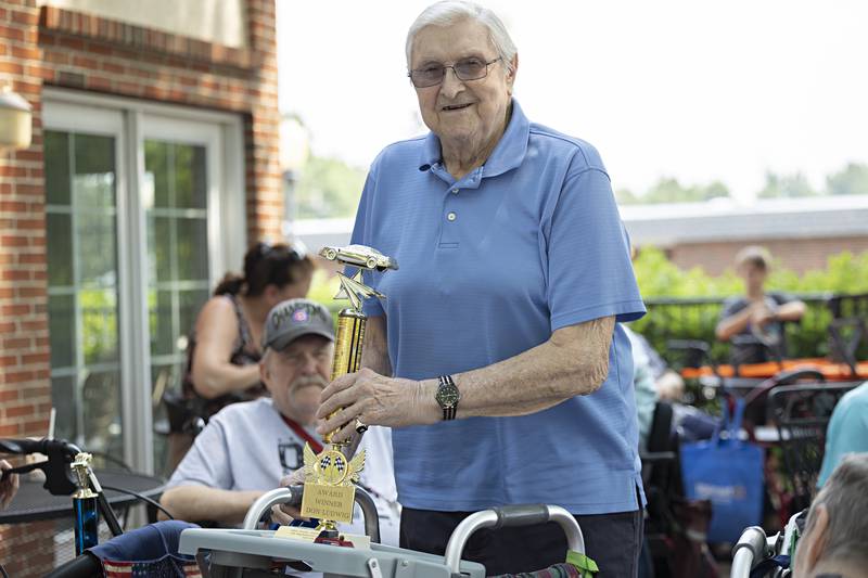 Don Ludwig receives his “Best Patriotic Car” trophy Friday, June 23, 2023 at Franklin Grove Assisted Living.