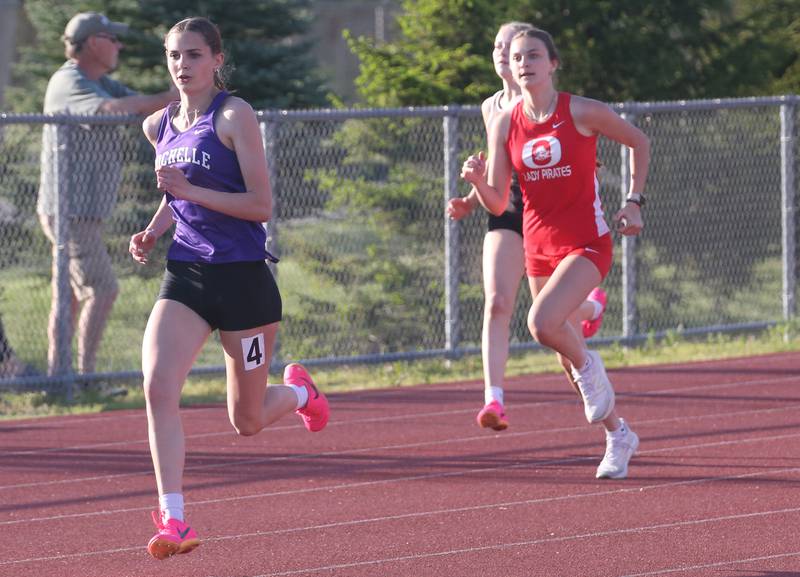 Rochelle's Kylie Smith and Ottawa's Shaylen Quinn run in the 400 meter race during the Interstate 8 conference track meet on Friday, May 3, 2024 at the L-P Athletic Complex in La Salle.