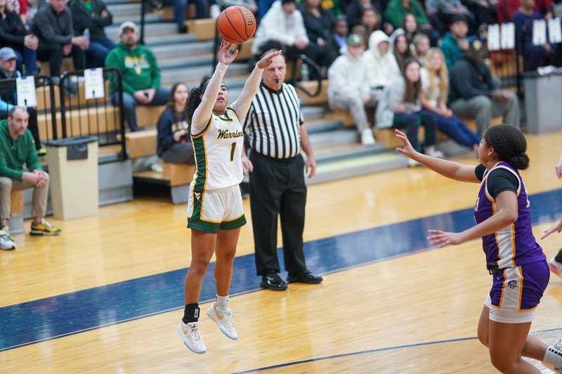 Waubonsie Valley's Arianna Garcia (1) shoots a three pointer against Downers Grove North's Kaitlyn Parker (24) during a Oswego semifinal sectional 4A basketball game at Oswego High School on Tuesday, Feb 20, 2024.