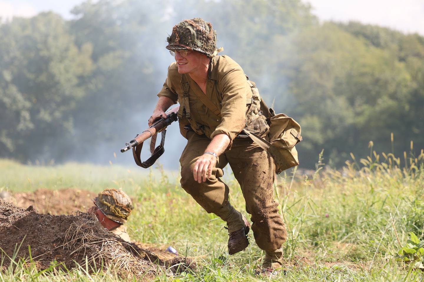 A US soldier runs for cover during the WWII battle re-enactment at Lockport Military History Days at Dellwood Park on Saturday, Sept. 9, 2023 in Lockport.