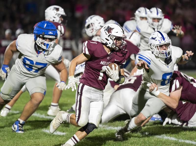 Prairie Ridge's Nick Petty runs the ball through Burlington Central's defense during their Fox Valley Conference game on Friday, October 11, 2024 at Prairie Ridge High School in Crystal Lake. Ryan Rayburn for Shaw Local