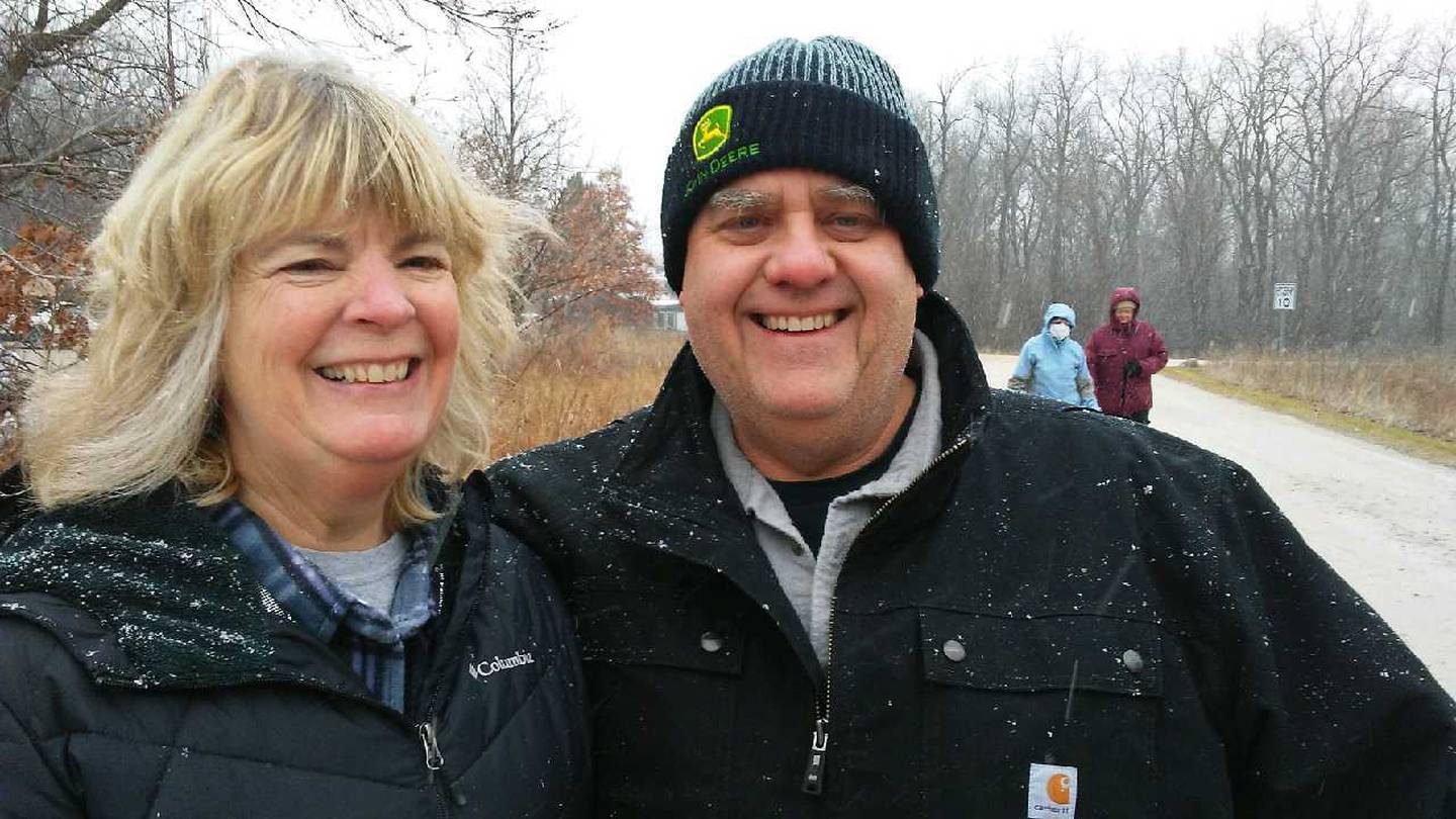 Dawn and Paul Mulligan of Yorkville braved the snowfall during the Kendall County New Year's Day Hike at the Hoover Forest Preserve. (Mark Foster - mfoster@shawmedia.com)