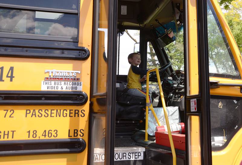 Children including Jack Rimlinger of La Grange enjoy honking the horns of large trucks buses and cars during the La Grange Park District's Touch A Truck event held at Sedgwick Park Saturday May 11, 2024.