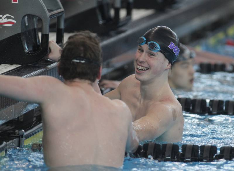 Downers Grove North’s Aiden Musso smiles after competing in the consolation heat of the 50-yard freestyle during the IHSA Boys State Championships at FMC Natatorium in Westmont on Saturday, Feb. 25, 2023.