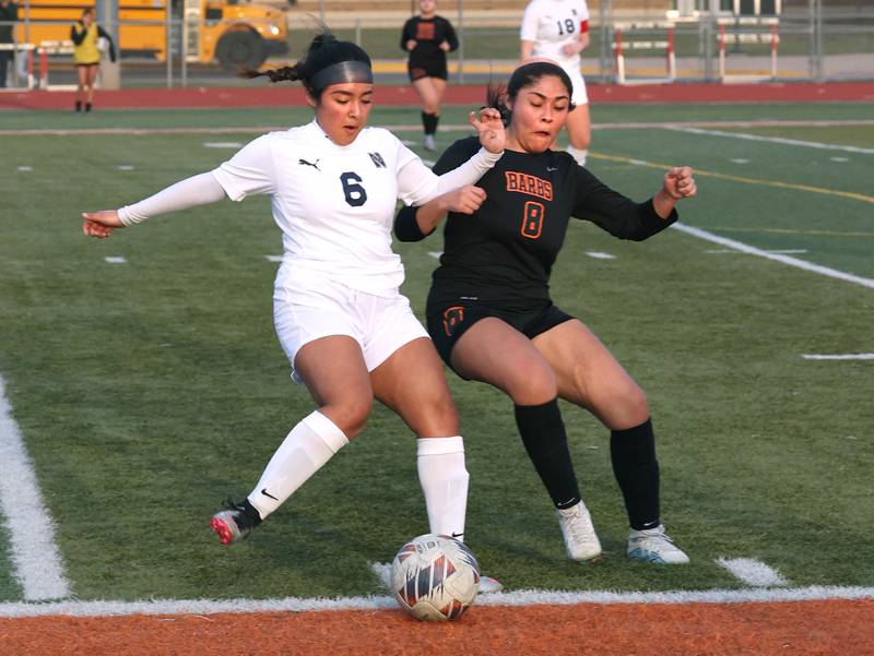 DeKalb's Carla Murrieta and Belvidere North's Keyla Suarez collide going after the ball during their game Tuesday, March 12, 2024, at DeKalb High School.