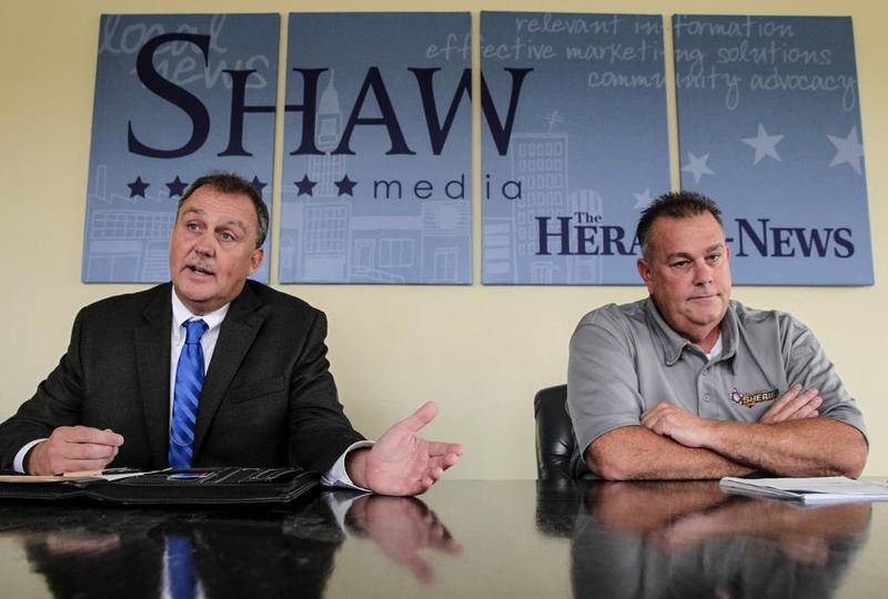 Republican candidate for Will County sheriff Jim Riley (left) and Sheriff Mike Kelley (right) speak with the Herald-News Editorial Board on Tuesday during a debate in Joliet.