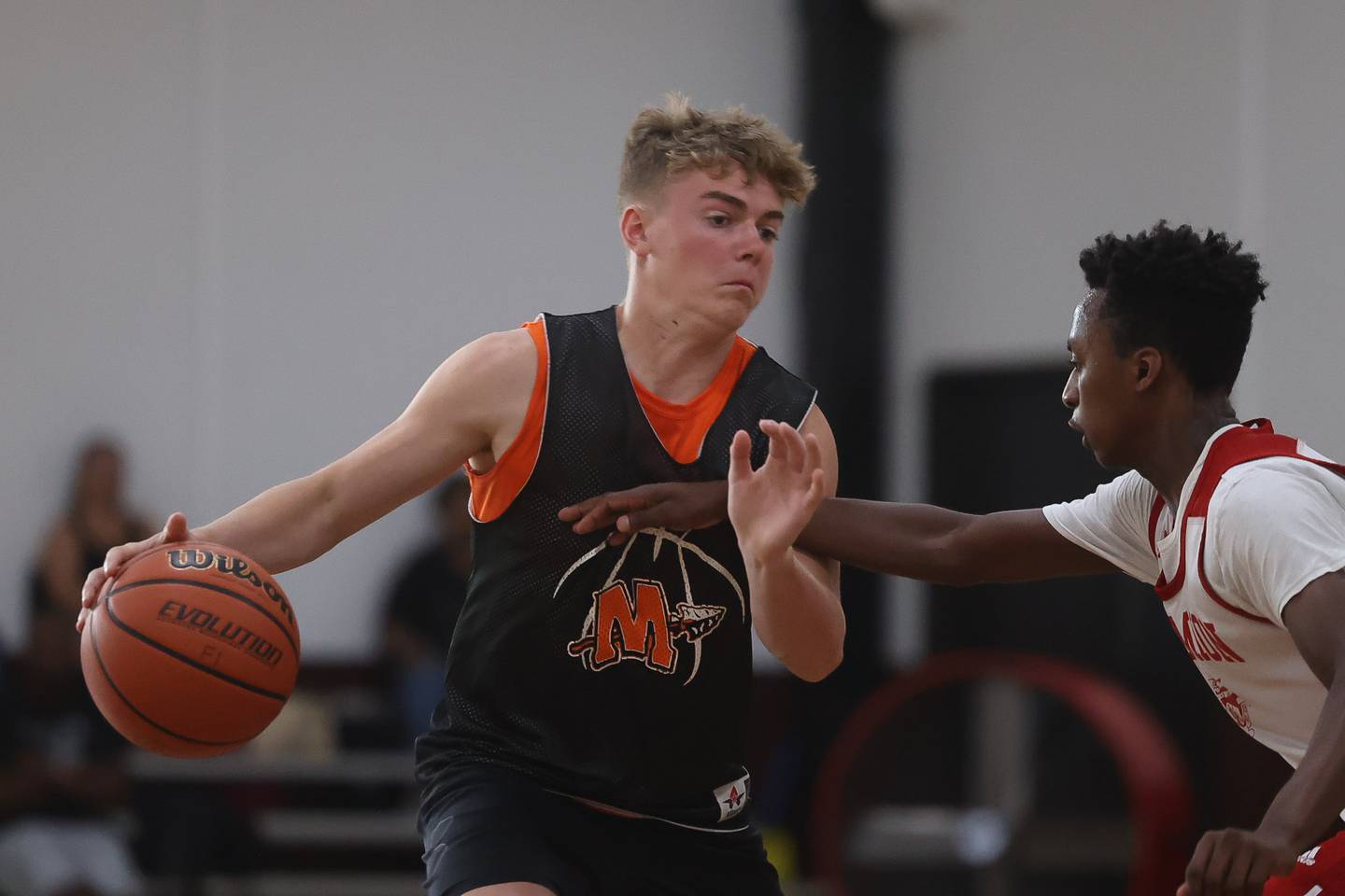 Minooka’s Brady Hairald makes a move against Marmion at the 37th Morris Boys Shootout on Tuesday, June 25, 2024.