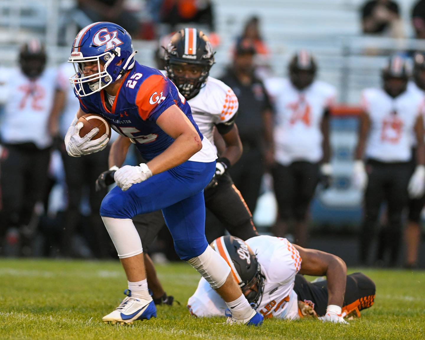 Genoa-Kingston's Peyton Meyer (25) gets tripped up by Leo Nicholas Armour during the first quarter of the football game on Friday Aug. 30, 2024, held at Genoa-Kingston High School.