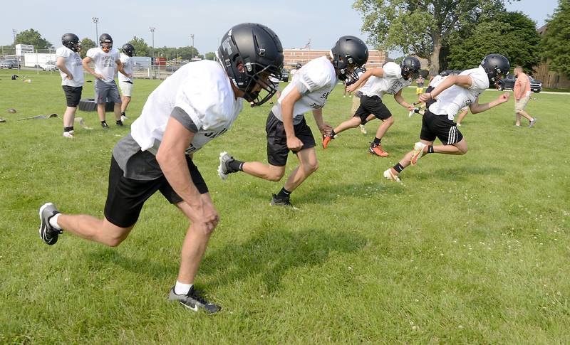 Sandwich players end their early summer football practice at Sandwich High School with running drills on Monday, July 17, 2023.