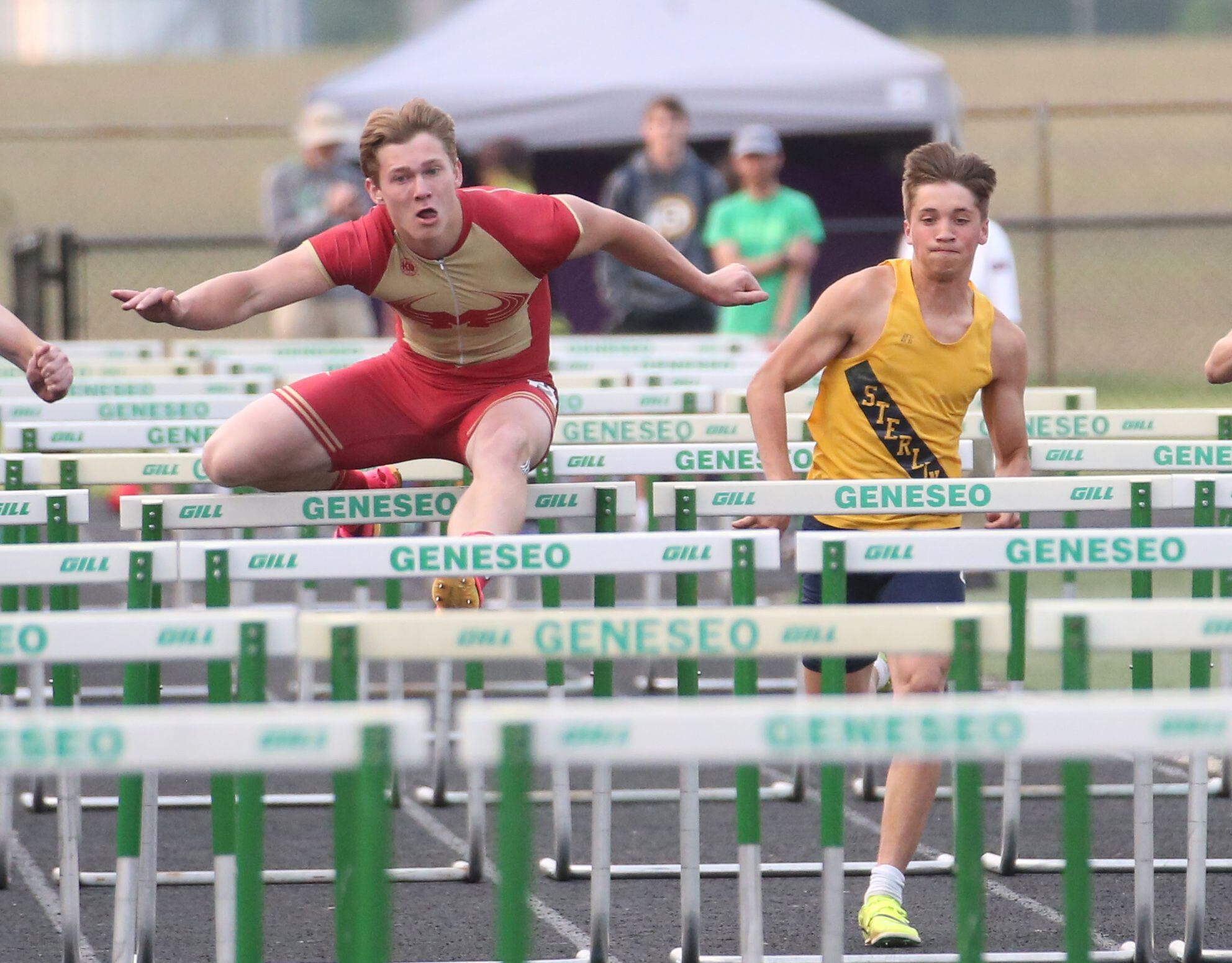 Morris' Noah Smith and Sterling's Andrew Bland compete in the 110-meter hurdles during the Class 2A track sectional meet on Wednesday, May 17, 2023 at Geneseo High School. 