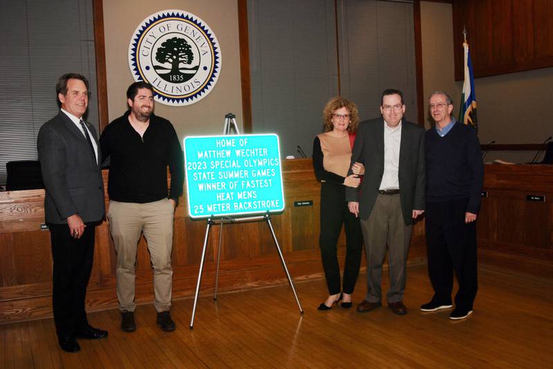 Matthew Wechter, (center left) flanked by his parents Connie and Larry, was honored for his achievement at the 2023 Special Olympics State Summer Games at Nov. 20, 2023 Geneva City Council meeting. The sign is posted at Route 38 and Bricher Road on the city’s west side. Also pictured are Mayor Kevin Burns (left) and Matthew’s older brother Aaron Wechter.